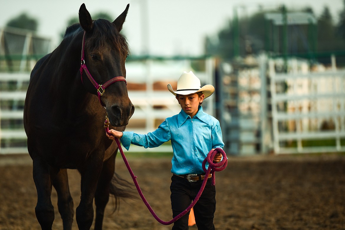 Annah Glimm leads her horse Sweetwater through the pattern in pre-junior level Showmanship at the 4-H Horse Show at the Northwest Montana Fair on Saturday, Aug. 14. (Casey Kreider/Daily Inter Lake)