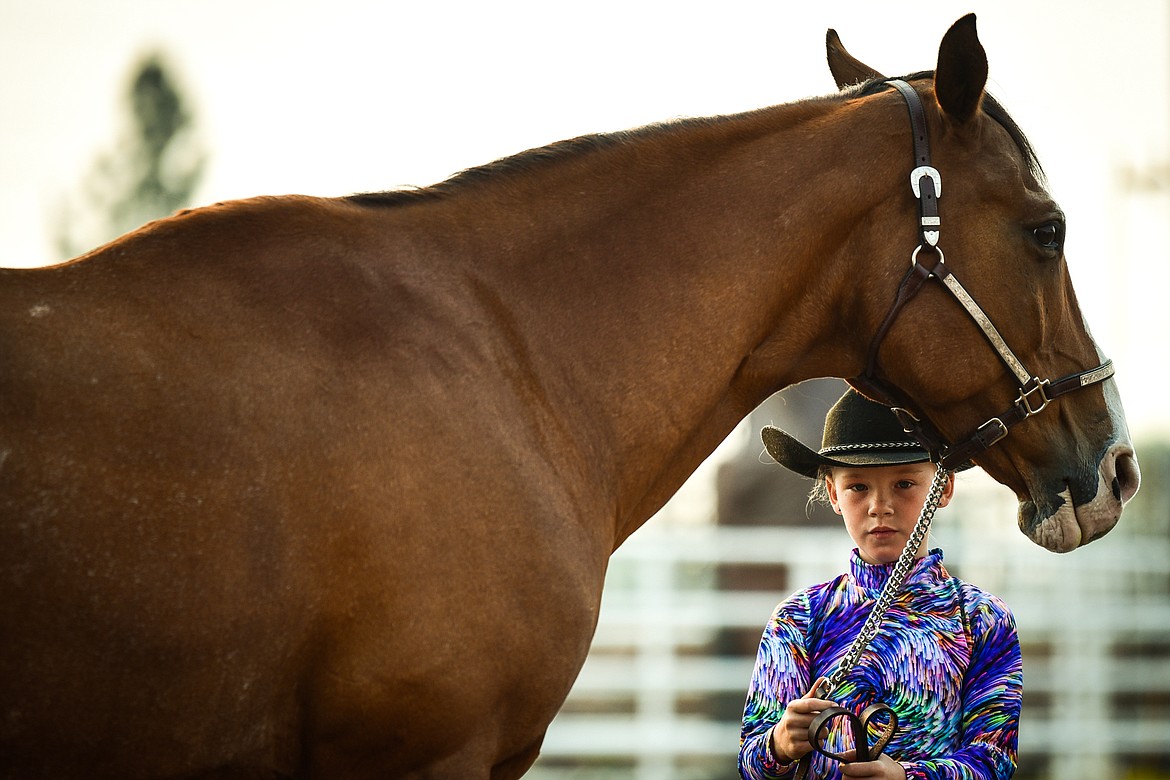 Kylie Boucher stands with her horse Sparky during novice level Showmanship at the 4-H Horse Show at the Northwest Montana Fair on Saturday, Aug. 14. (Casey Kreider/Daily Inter Lake)