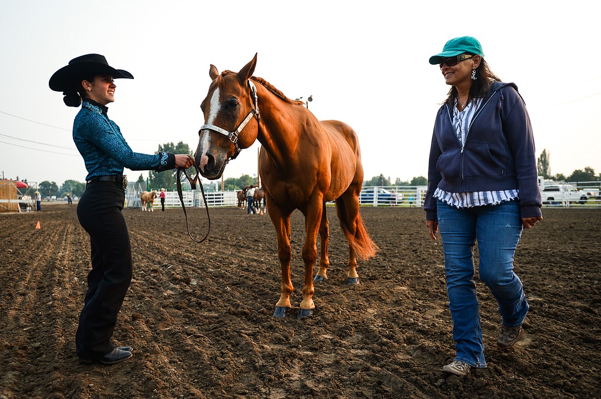 Anna Tretter, left, shows her horse Bugsy as ring steward Melissa Smith circles around during the 4-H Horse Show at the Northwest Montana Fair on Saturday, Aug. 14. (Casey Kreider/Daily Inter Lake)