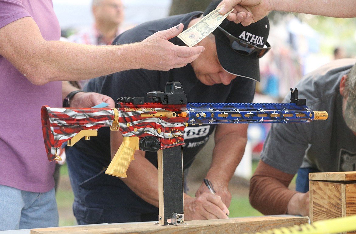 American Legion Post 149 sells tickets to win an AR-15 at City Park dueing the Athol Daze celebration.