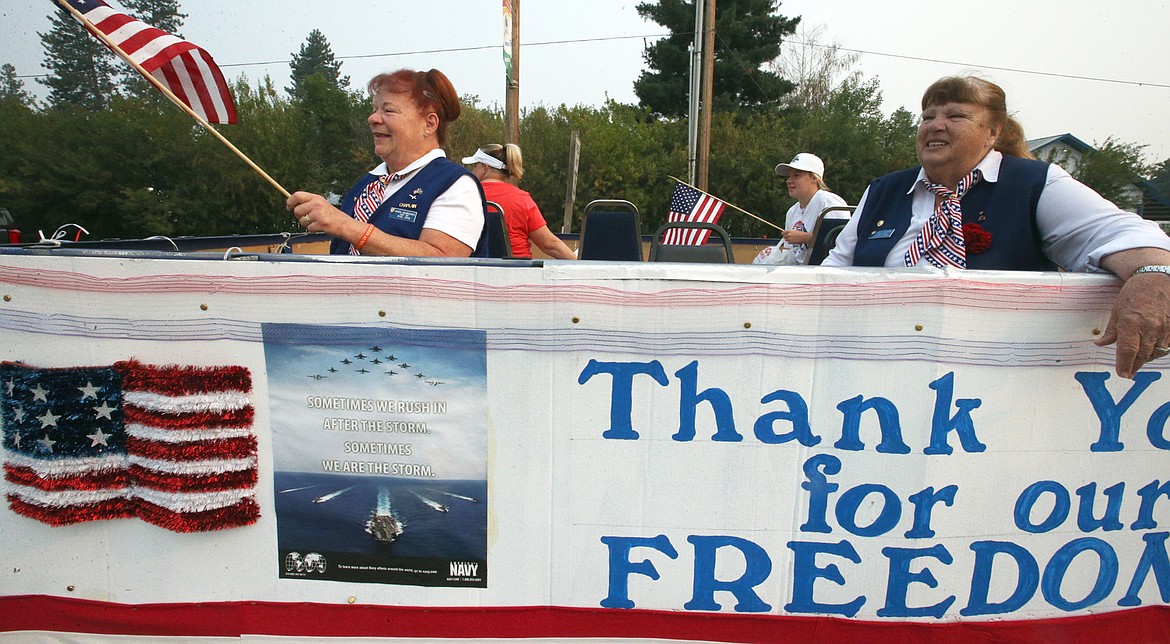 Caren Crumpacker, left, and Judy Tustison, with the American Legion 149 Auxiliary, wave during the Athol Daze parade.