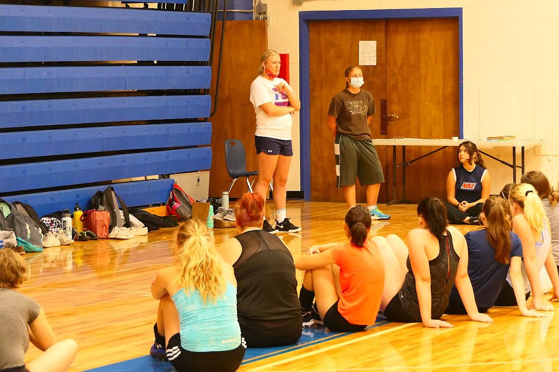 Superior volleyball coach Kyra McElroy (standing) addresses her team during the first day of practice. (Chuck Bandel/Mineral Independent)