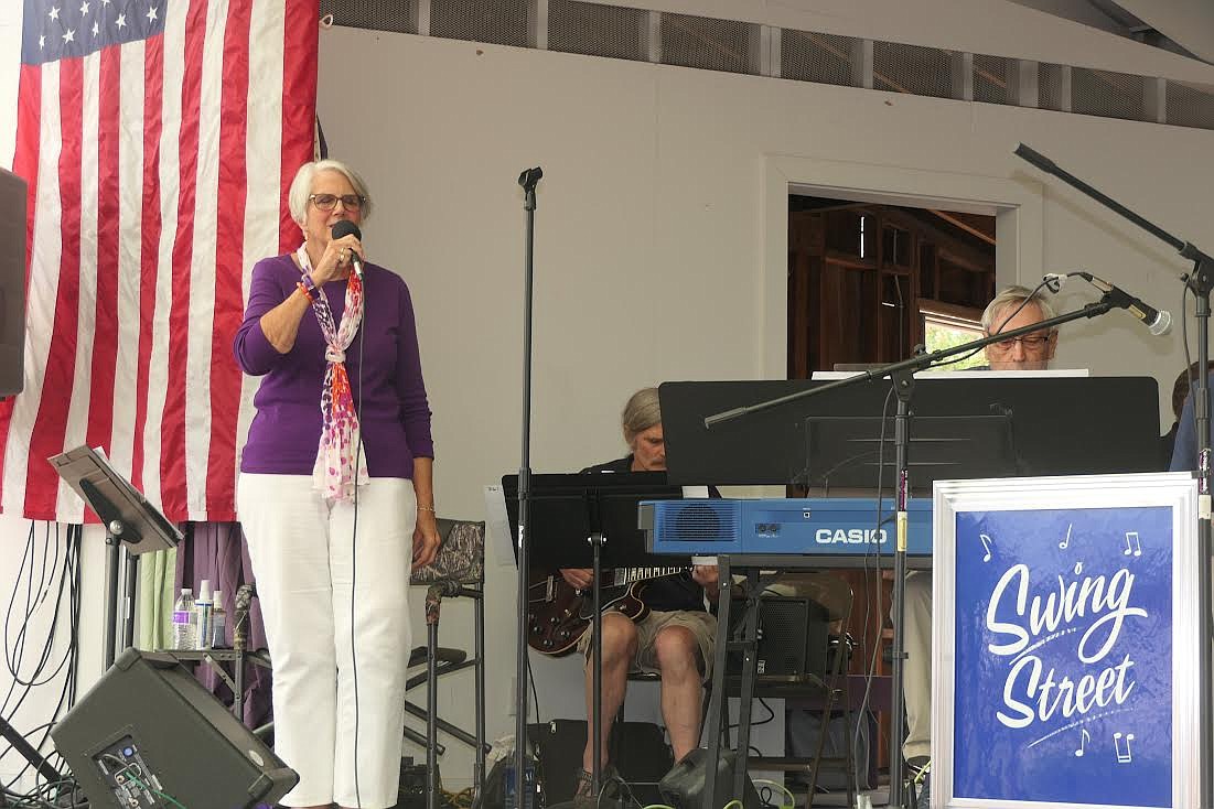 Swing Street Big Band vocalist Maria Larson sings at last week’s the Trout Creek Huckleberry Festival. (Adam Lindsay/Valley Press)