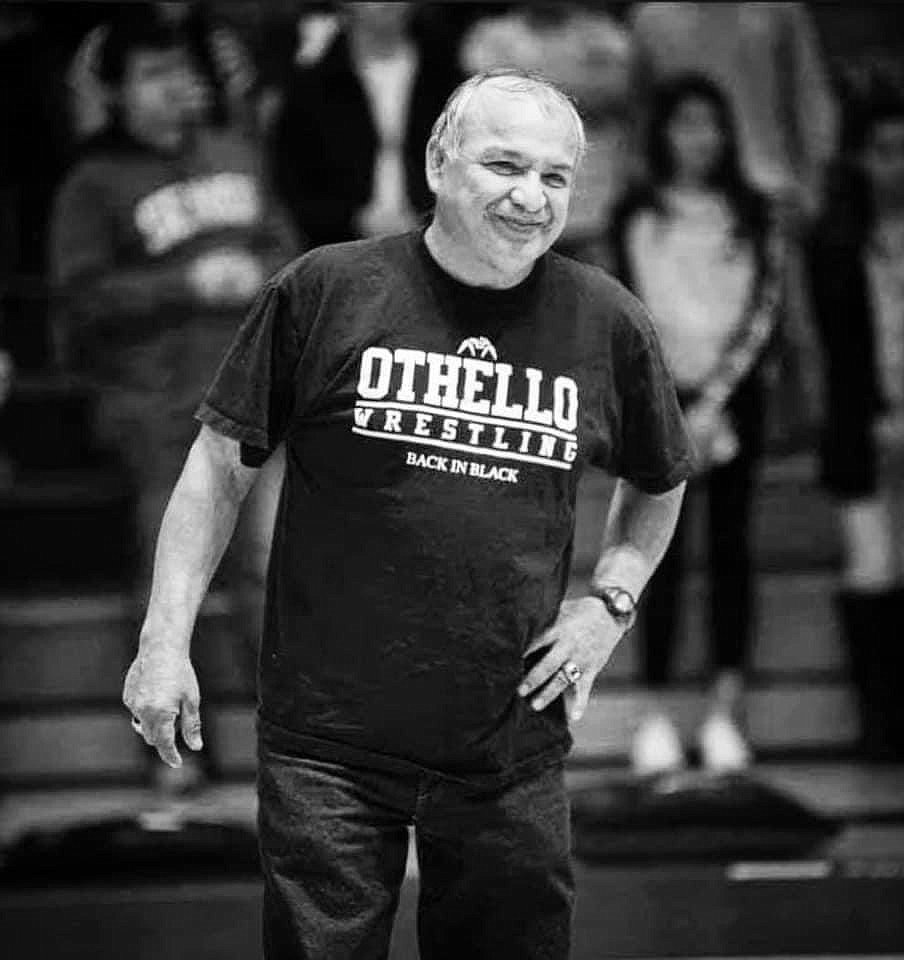 Former Othello High School wrestling coach Ruben Martinez steps onto the mat before his last home dual meet at Othello High School in 2015.