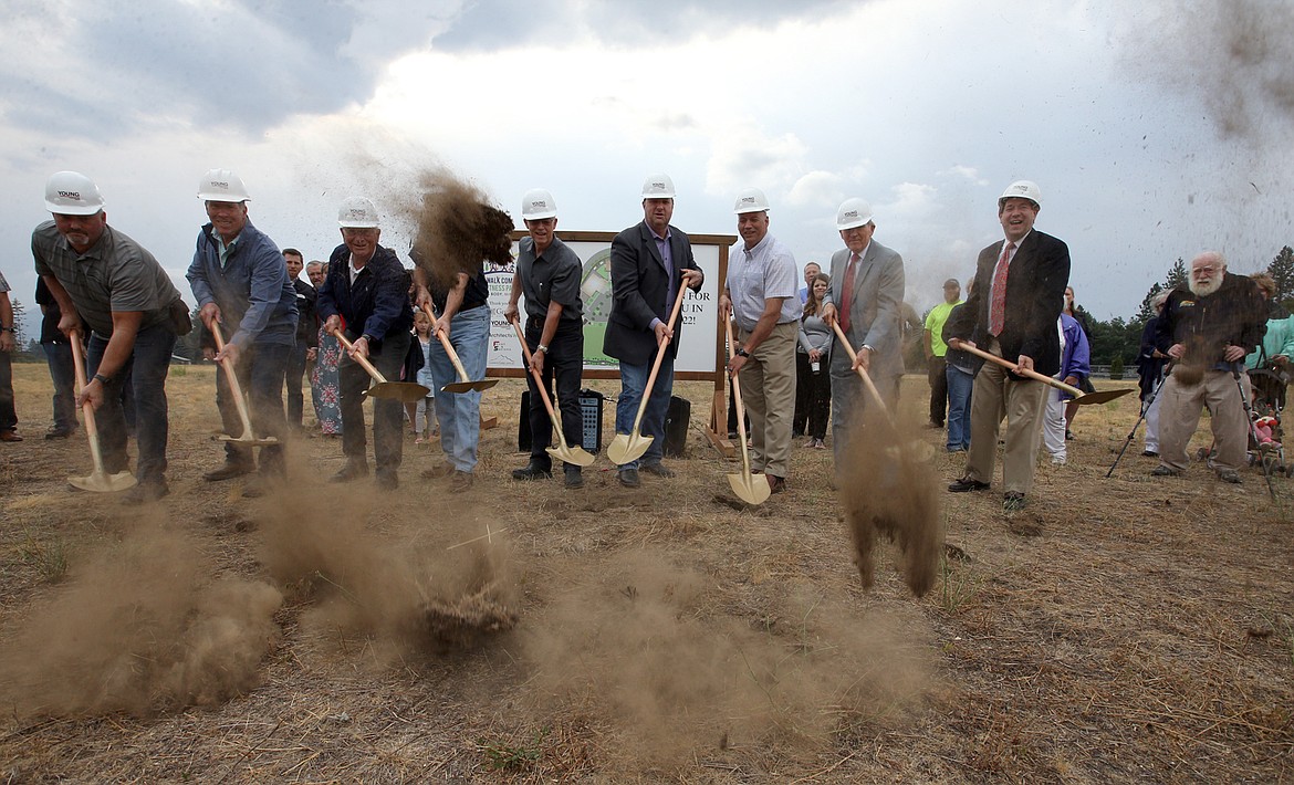 The groundbreaking ceremony for the Faith Walk Community Fitness Park in Coeur d'Alene on Tuesday. From left, Dwight Bershaw, John Young, Jim Faucher, Marcus Valentine, Paul Peabody, Mitchell Martin, Erik Rockett, Steve Smith and Dan Pinkerton.