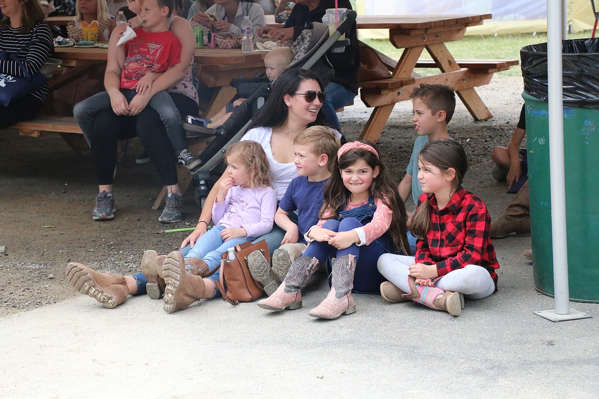 A family has fun watching a magic show at the Bonner County Fair on Wednesday.