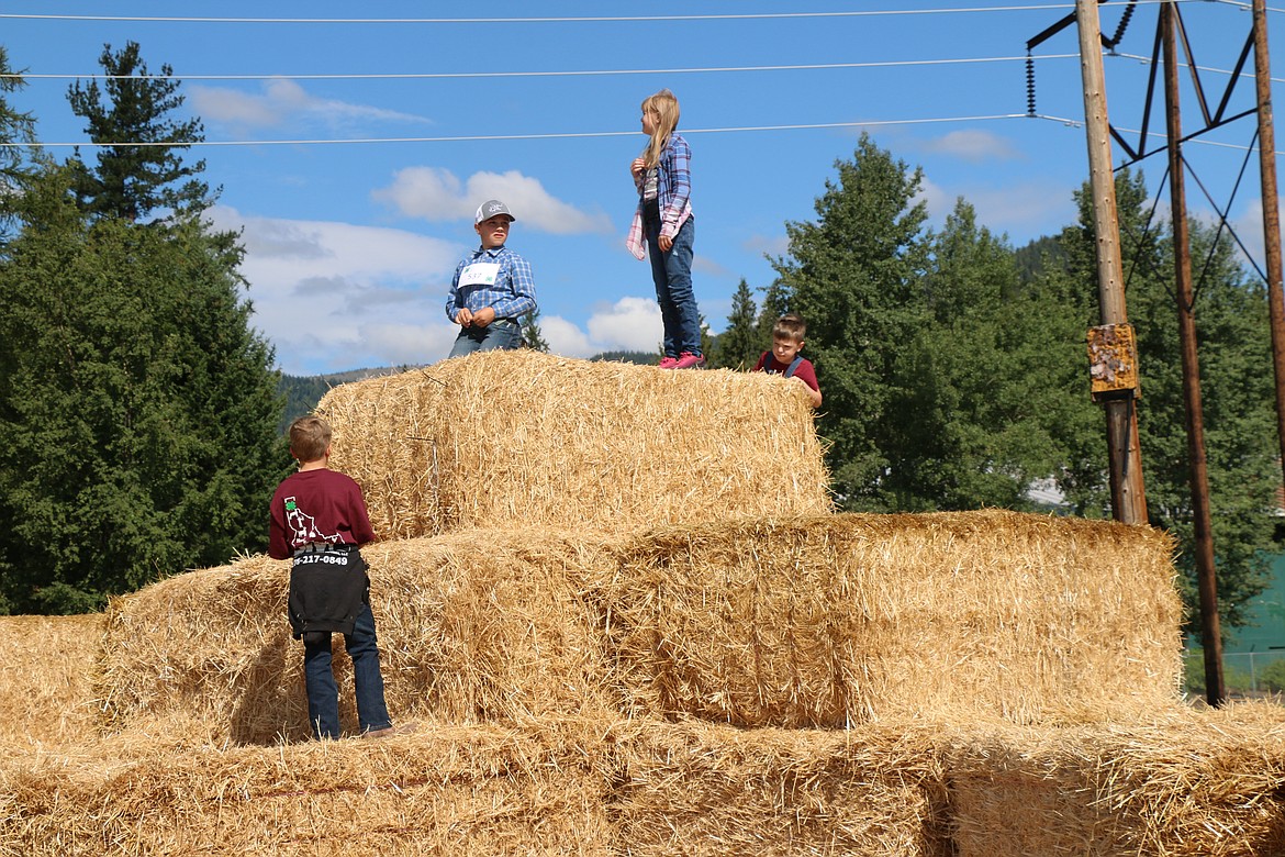 Youngsters have fun on giant hay bales at the Bonner County Fair on Wednesday.