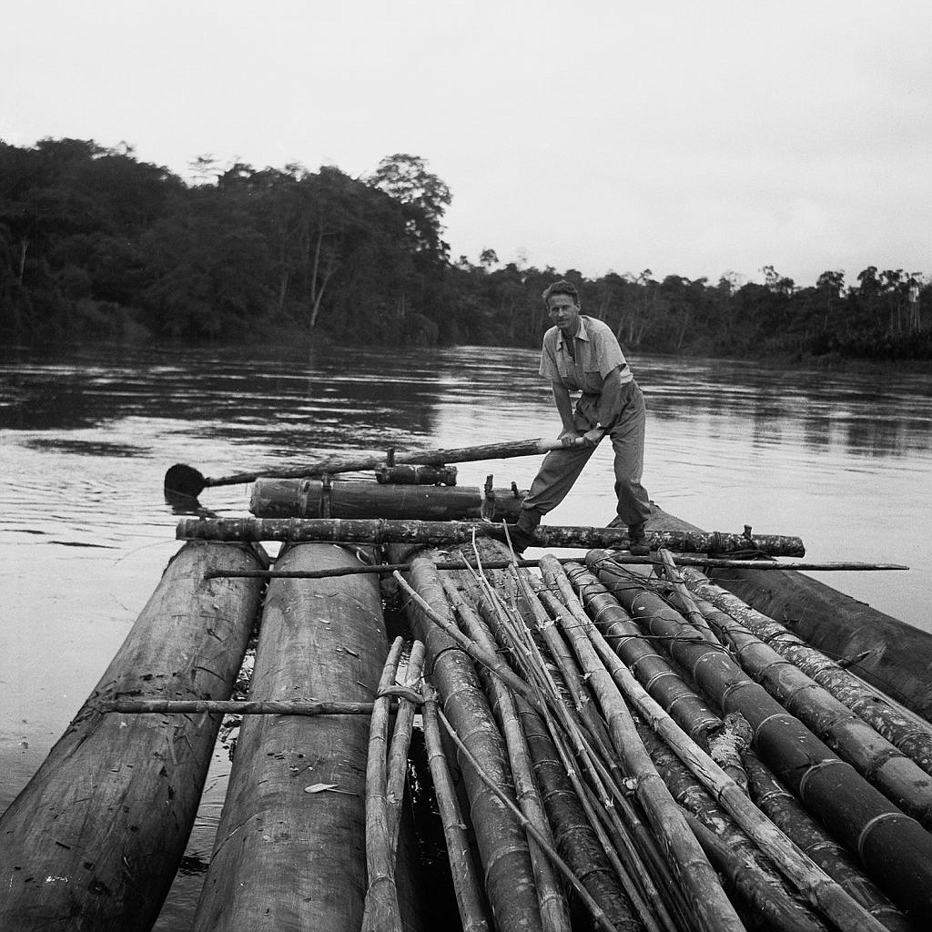 Thor Heyerdahl shown here with balsa wood logs that formed the hull of his Kon-Tiki that also used other wood such as bamboo for parts of the raft; the balsa harvested in Ecuador and shipped to Callao in Peru where the raft was built and launched on its historic journey.