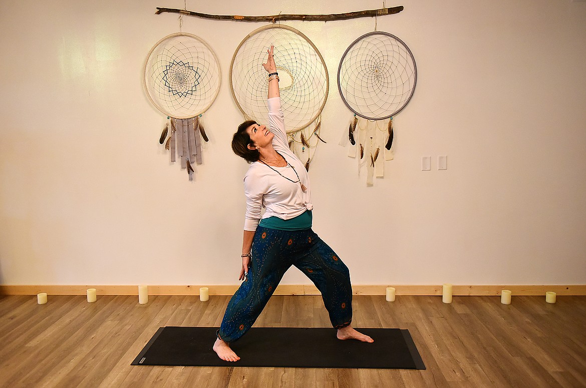 New owner Michelle "Shelle" Kuntz practices yoga in the Whitefish Yoga Hive studio. (Heidi Desch/Daily Inter Lake)