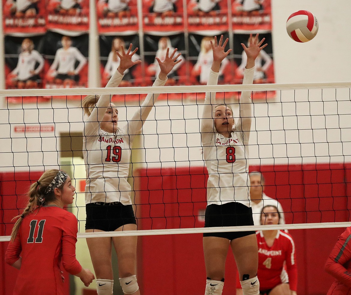 Tori Pelkey (left) and Hailey Roeder elevate to block a shot during a match against Moscow on Oct. 20, 2020, at Les Rogers Court. Roeder will make her return to the court following an injury.