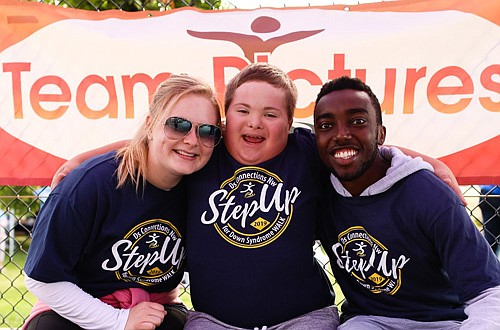 Smiling during the 2019 Step Up for Down Syndrome Walk from left: Jordyn Andrade, Riley Kibbe and Doug Kempthorne; 2020 's event was held virtually due to the COVID-19 pandemic and organizers are pleased to host the event live again this year