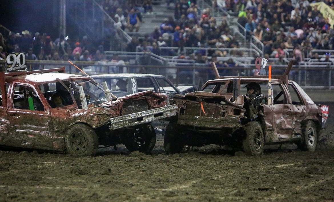 Kody Vandeweghe, 90, and Mike Bise, 92, collide in the center of the arena before tying for first place in the final event of the night at the Northwest Ag Demolition Derby on Wednesday.