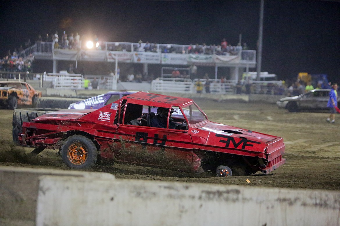 Rylie Miller, No. 94, does his best to round the corner minus a tire on Wednesday night at the Northwest Ag Demolition Derby.