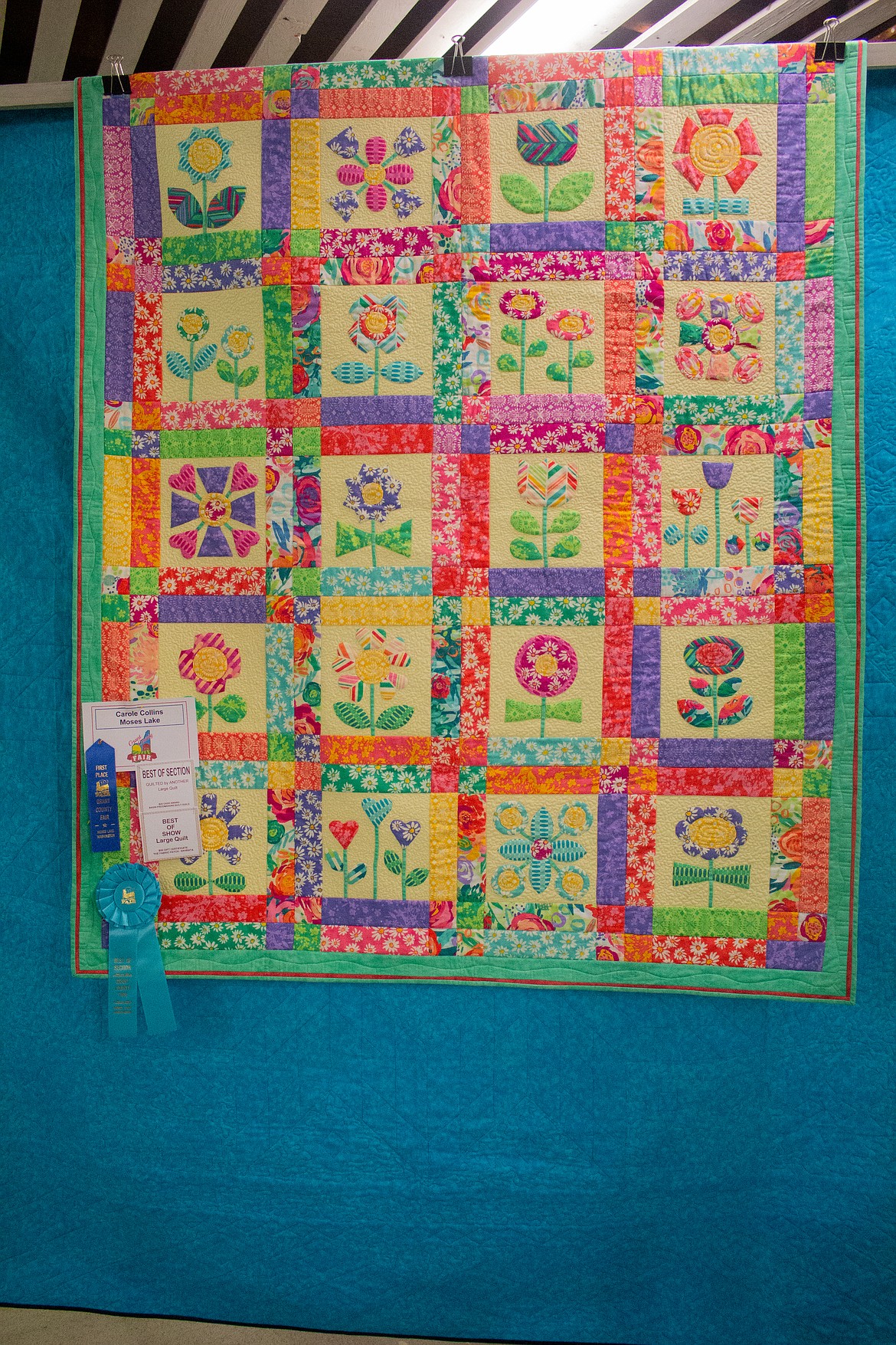 The Best of Show quilt in the large quilt, “quilted by another,” division by Carole Collins of Moses Lake hangs up inside the Home Ec Building at the Grant County Fairgrounds Tuesday morning.