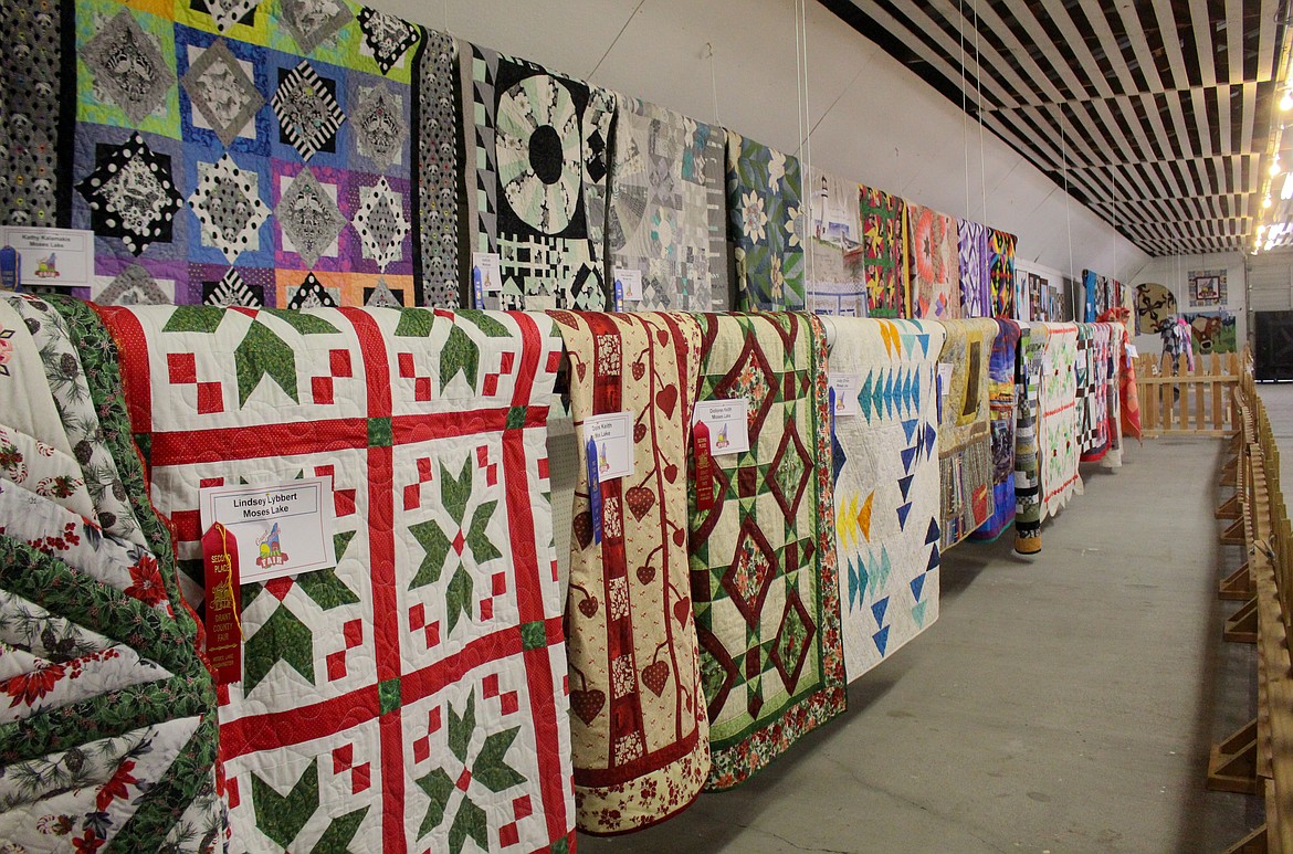 Quilts line the wall inside the Home Ec Building at the Grant County Fairgrounds on Tuesday morning.