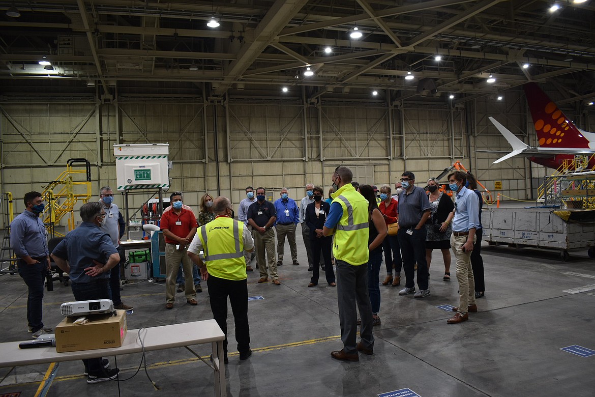 Members of the Washington state Legislature at Boeing’s hangar see how 737 MAX aircraft are readied for their return to service during a tour of the Port of Moses Lake on Thursday, Aug. 12.