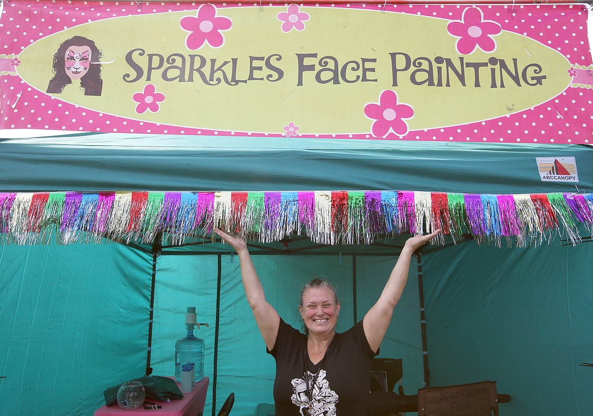 Nicole Beam of Nine Mile Falls, Wash., is all smiles as she brings Sparkles Face Painting to the North Idaho State Fair.