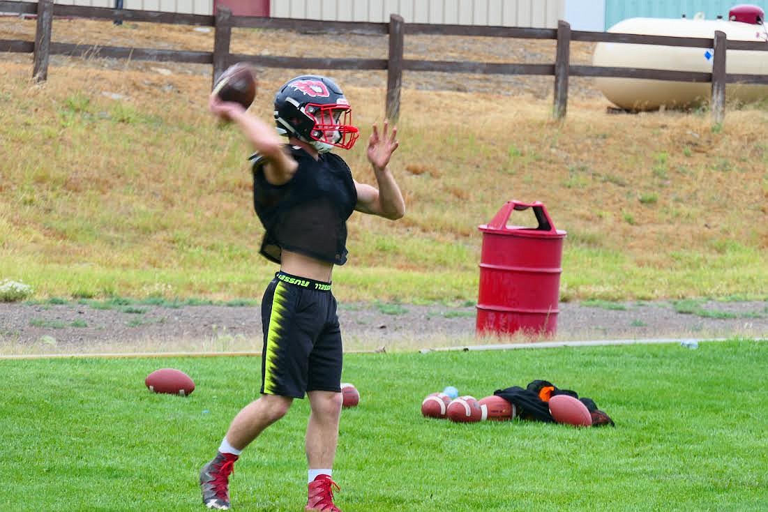 Hot Springs all-conference quarterback Jack McAllister tosses the ball in practice last week. (Chuck Bandel/Valley Press)