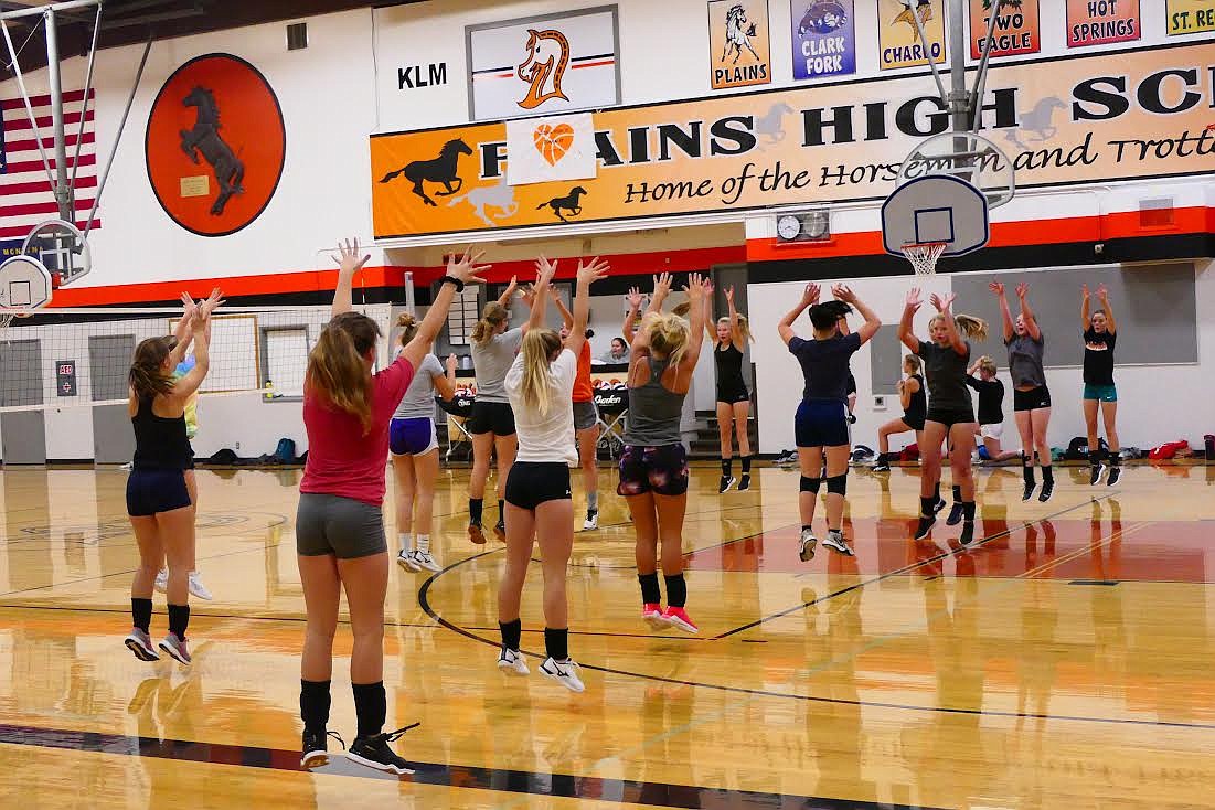 Members of the Plains Trotters volleyball team warm up during a recent practice. (Chuck Bandel/Valley Press)