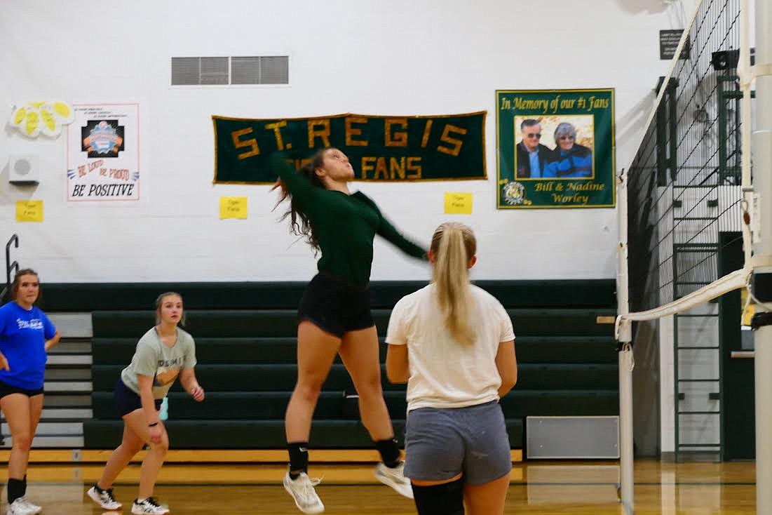 St. Regis freshman Averie Burnham goes high for a return during a recent practice. (Chuck Bandel/Valley Press)