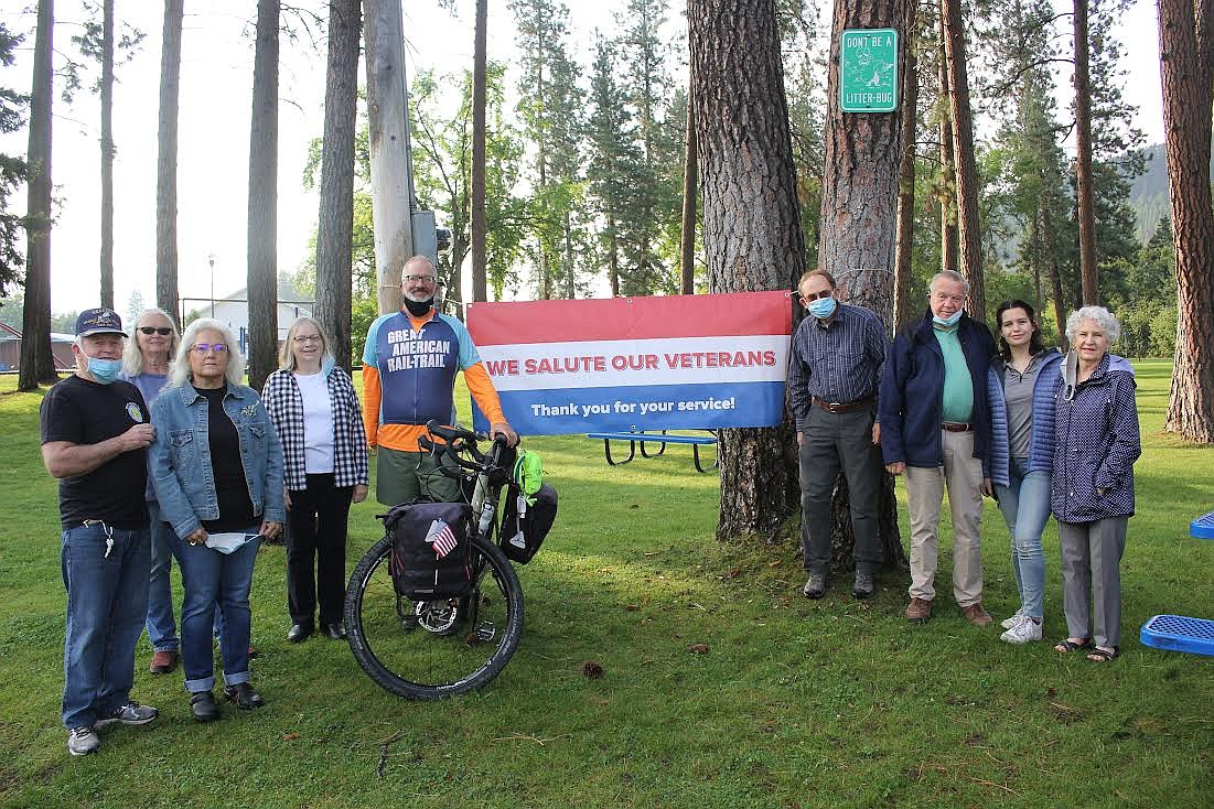 Colonel Jay Waters, retired from the U.S. Army, was welcomed to Superior by residents last week who supported his cross country ride. From left, are Ron Forest, Linda Forest, Cathy Kuhl, Diane Magone, Waters, Bert Lindler, Kenton Lewis, Mikael Jacovelli and Debra Lewis. (Monte Turner/Mineral Independent)