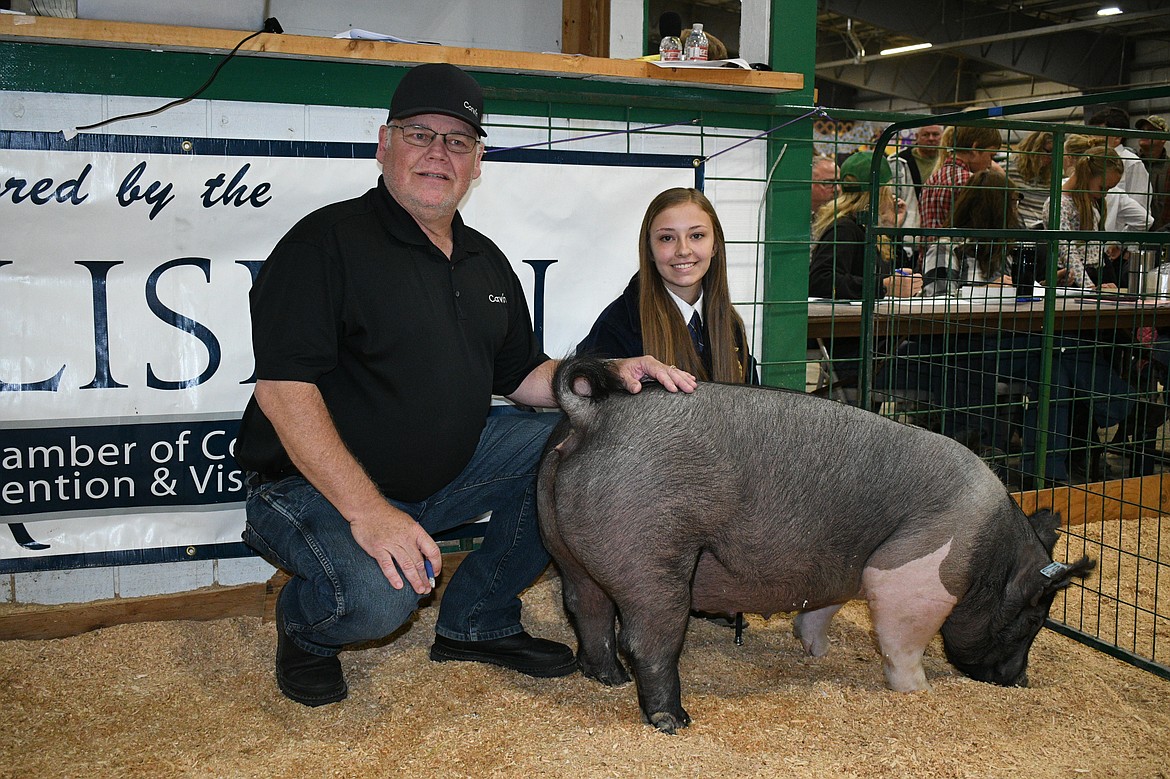 Kinzey Davis sold her grand champion hog to Corwin Auto Group for $13.25 per pound during the Market Livestock Sale at the Northwest Montana Fair on Saturday, Aug. 21, 2021. (Courtesy of Alicia Craft Gower)