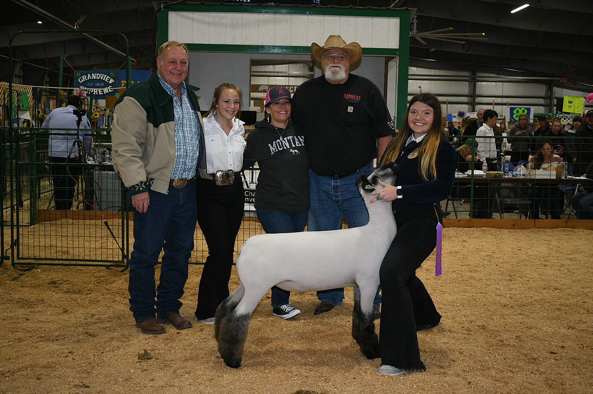 Bailey Lake sold her grand champion lamb to Sargent Transportation for $21.00 per pound at the Market Livestock Sale on Saturday, Aug. 21, 2021. (Courtesy of Alicia Craft Gower)