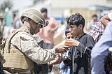 US troops surge evacuations out of Kabul but threats persist