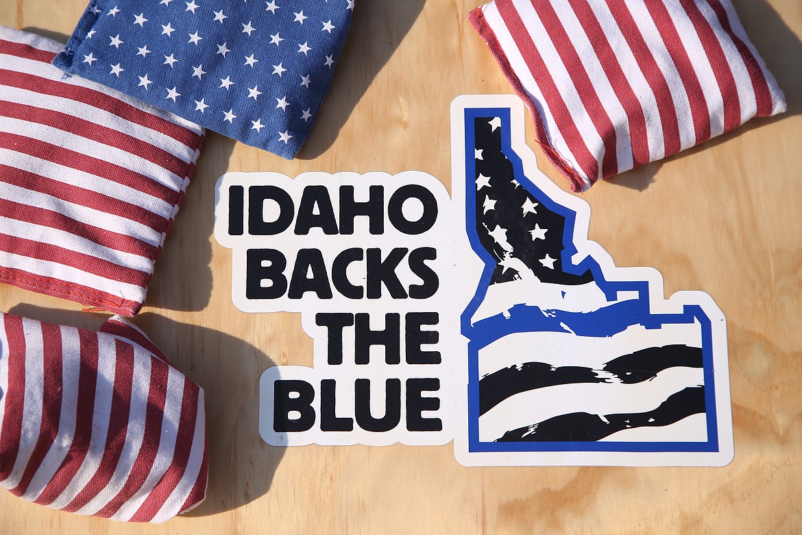 The corn hole board in front of the Chaplain's booth at the 2021 Bonner County Fair reads "Idaho Backs the Blue."