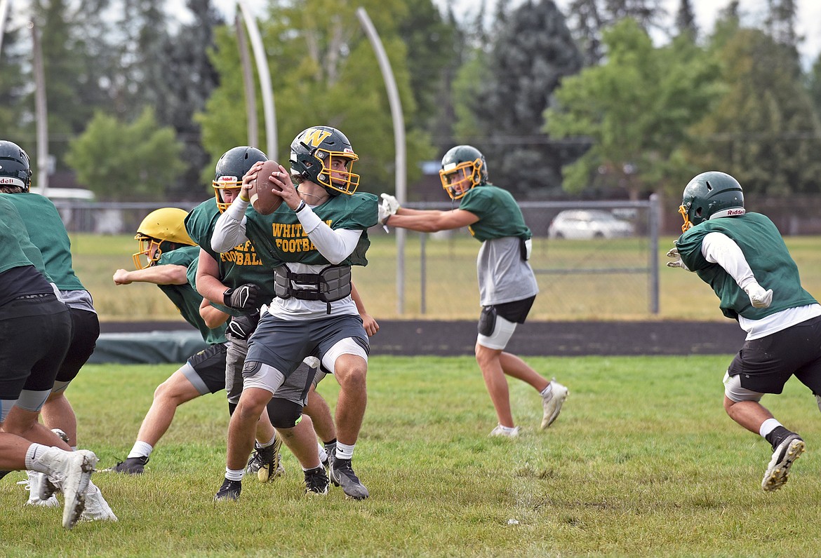 Whitefish quarterback Fynn Ridgeway runs a drill during practice on Wednesday. (Whitney England/Whitefish Pilot)