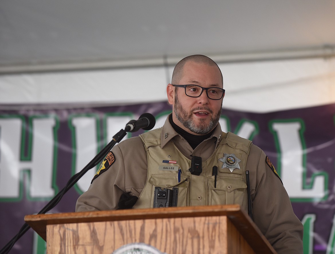 Flathead County Sheriff's Posse Cmdr. Travis Sallee voices gratitude for a donation of 65 radios from L3Harris Technologies during a ceremony Friday, Aug. 20, 2021, at the Northwest Montana Fair and Rodeo in Kalispell. (Scott Shindledecker/Daily Inter Lake)