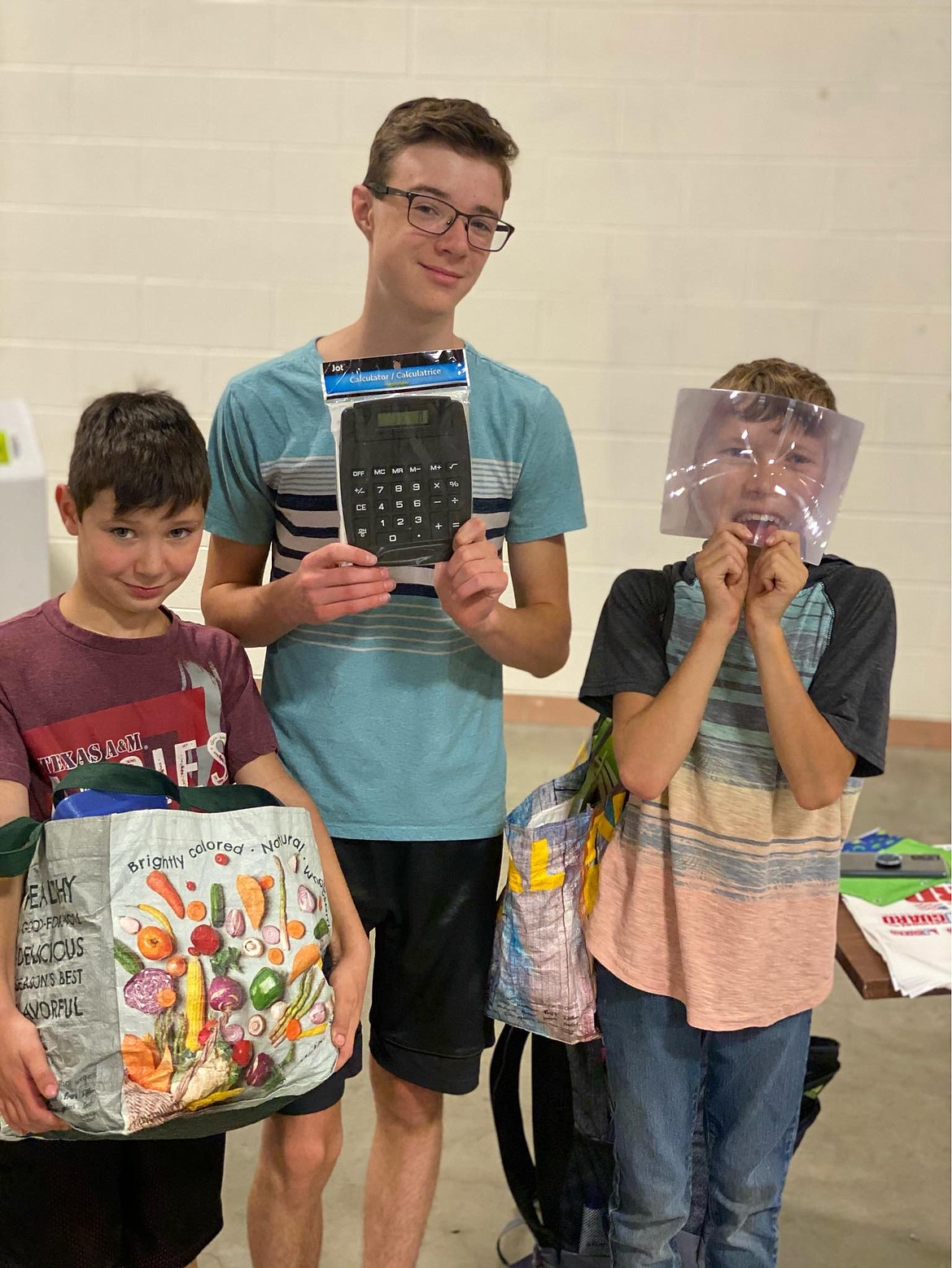 From left, Eli, fourth grade; Blake, 10th grade; and Brayden Lorchan, sixth grade, children of Jesse Lorchan, Sergeant First Class, of Post Falls pick out school supplies at the annual Back-to-School Brigade at the Idaho Army National Guard in Post Falls. Photo courtesy of Cassandra Rzepa