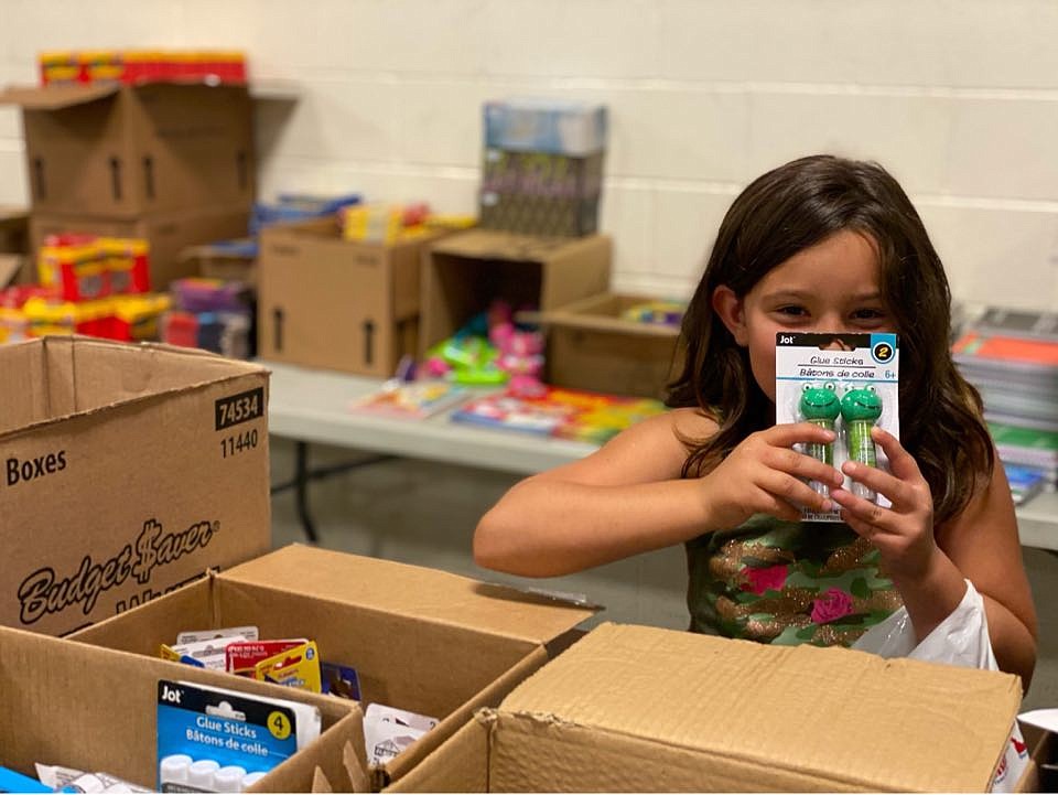 Bree Maas, 9, from Bonners Ferry, picks out school supplies at the Back-to-School Brigade at the Idaho Army National Guard post in Post Falls. Photo courtesy of Cassandra Rzepa