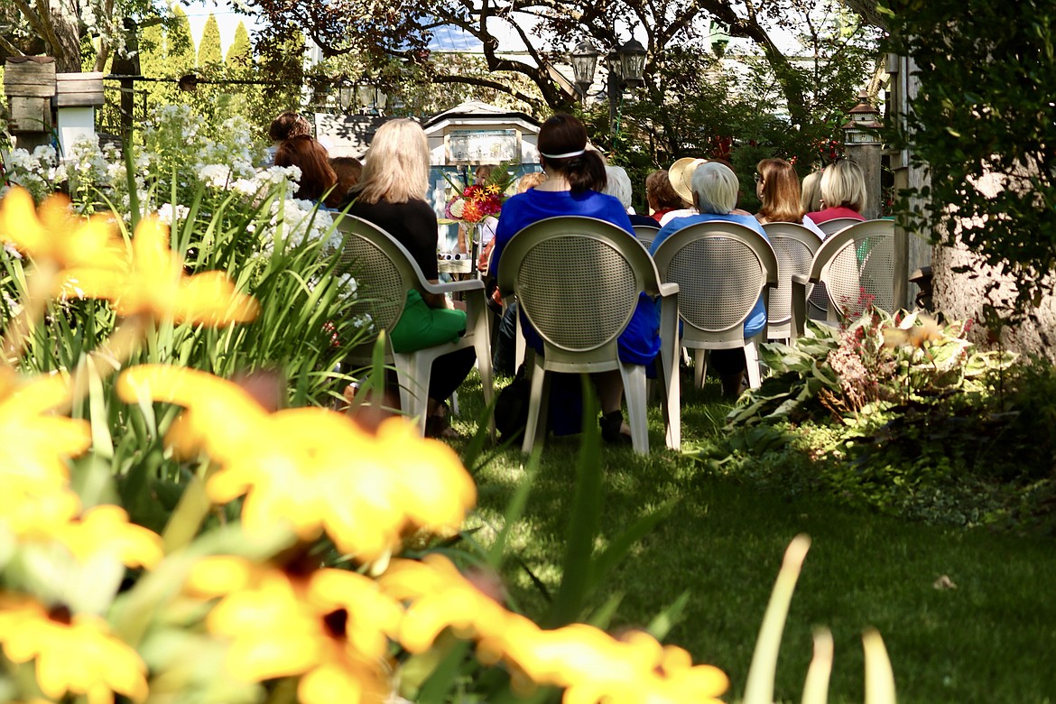 The Coeur d'Alene Garden Club donated $16K to 12 different local nonprofits through funds raised by their 23rd annual Garden Tour. The distribution was held in the private garden of Ed and Tina Hood in Dalton Gardens on Tuesday. HANNAH NEFF/Press