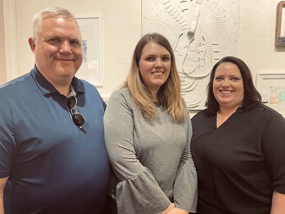 Royal High School art teacher Hanah Allen, center, poses with her parents Chuck (left) and Laura Allen.