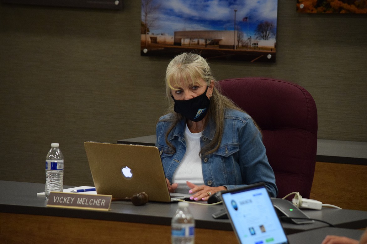 Moses Lake School Board President Vickey Melcher sits at her desk at the end of a special meeting Tuesday evening.