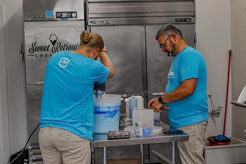 Co-owners Lee Davis, left, and Bruce Crockett make a batch of ice cream at the new Sweet Retreat Creamery in Columbia Falls. (Courtesy photo)
