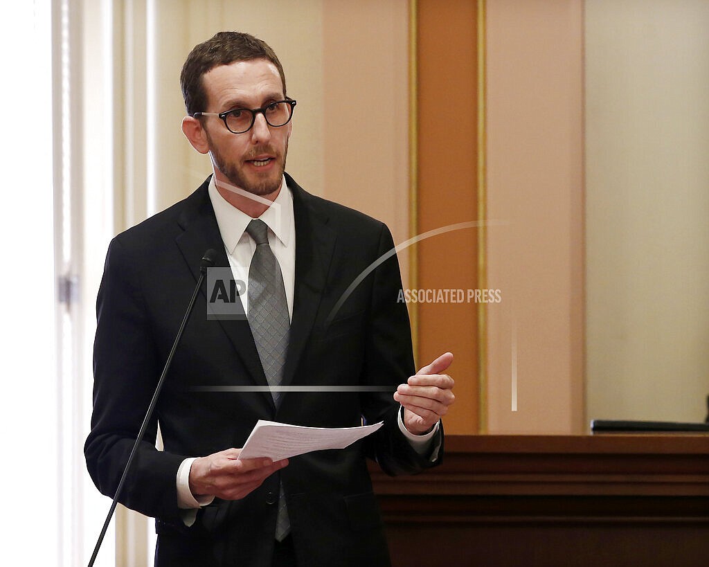 In this Sept. 12, 2019, file photo, Democratic state Sen. Scott Wiener addresses the state Senate at the Capitol in Sacramento, Calif., Wiener has introduced a bill to pay people struggling with drug addiction to stay sober. People would earn small payments for every negative drug test over a set period of time. The measure has already passed the Senate without opposition and is pending in the Assembly. (AP Photo/Rich Pedroncelli, File)