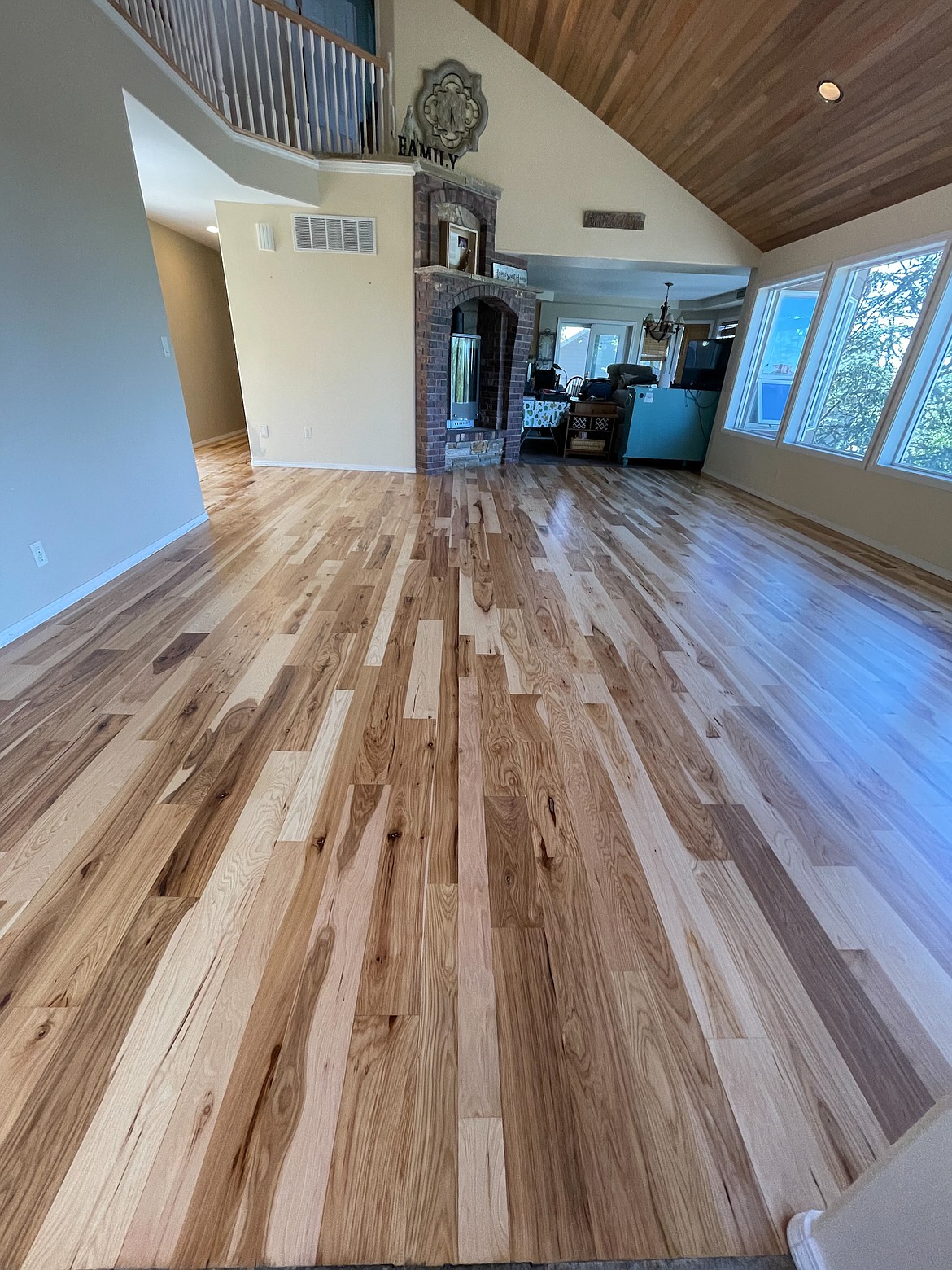 A wood floor by Basin Wood Floors in Moses Lake featuring hardwood that was hand-finished and sanded on-site.