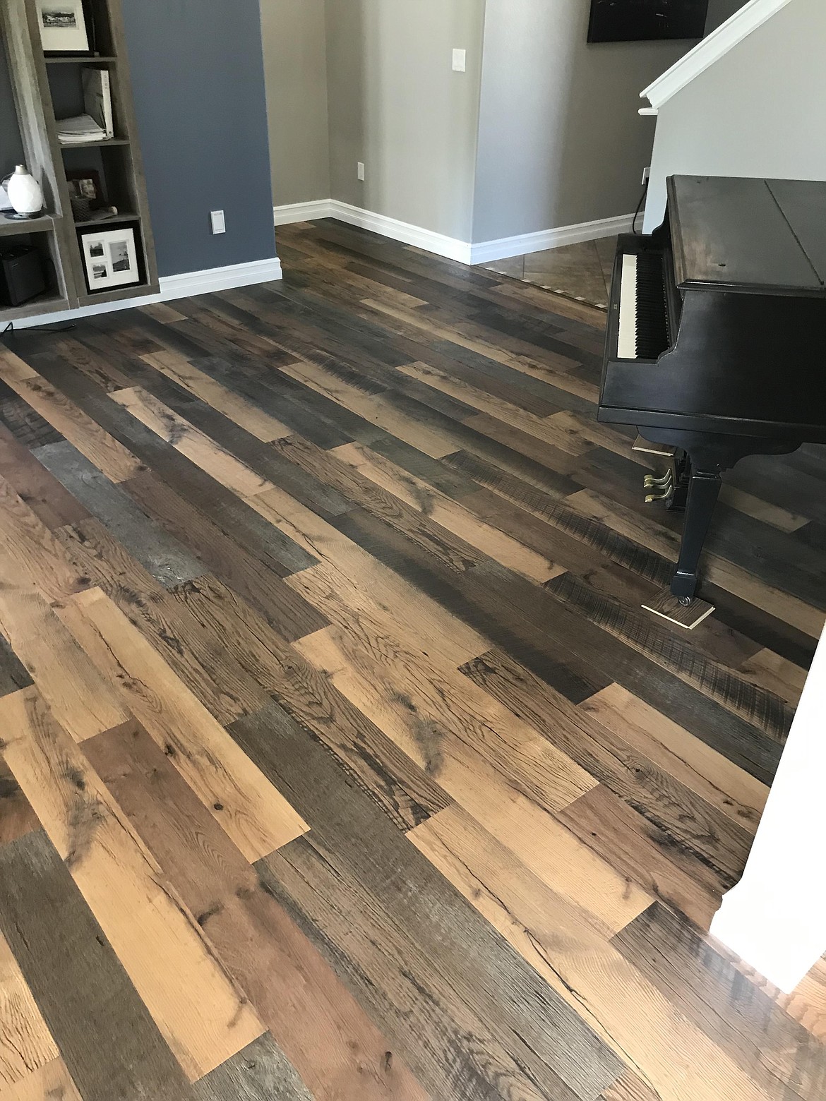 Laminate wood flooring, pictured here, often features a repetition in pattern with only a select variety of different wood pieces assembled together.