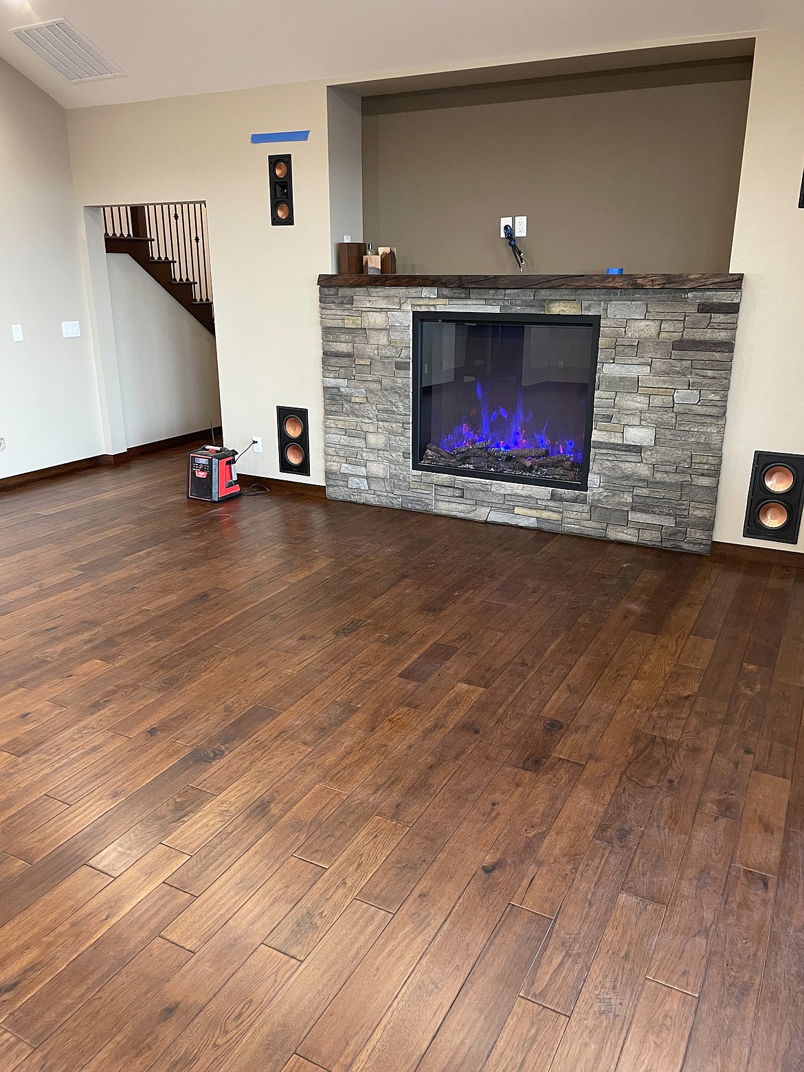 A view of a flooring job done by Basin Wood Floors featuring prefinished hardwood with natural wood tones, one of the more popular choices for the company’s customers recently.