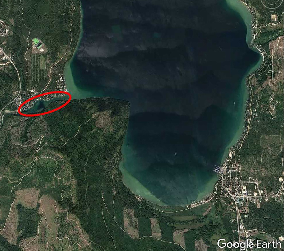 A harmful algae blooms has been detected at the Priest Lake Outlet. A red oval shows the HAB area, which runs from Outlet Bay Road to the dam.