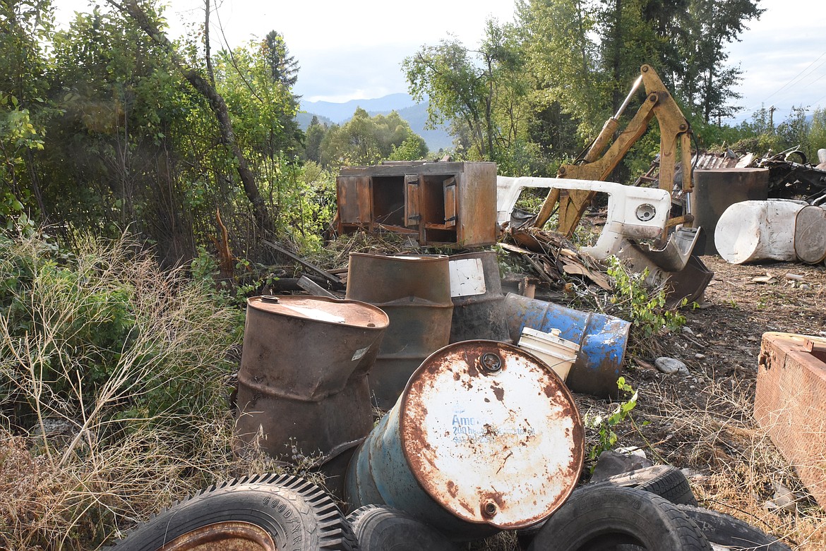 Piles of debris are stacked up on public land off of City Service Road in Libby. (Derrick Perkins/The Western News)