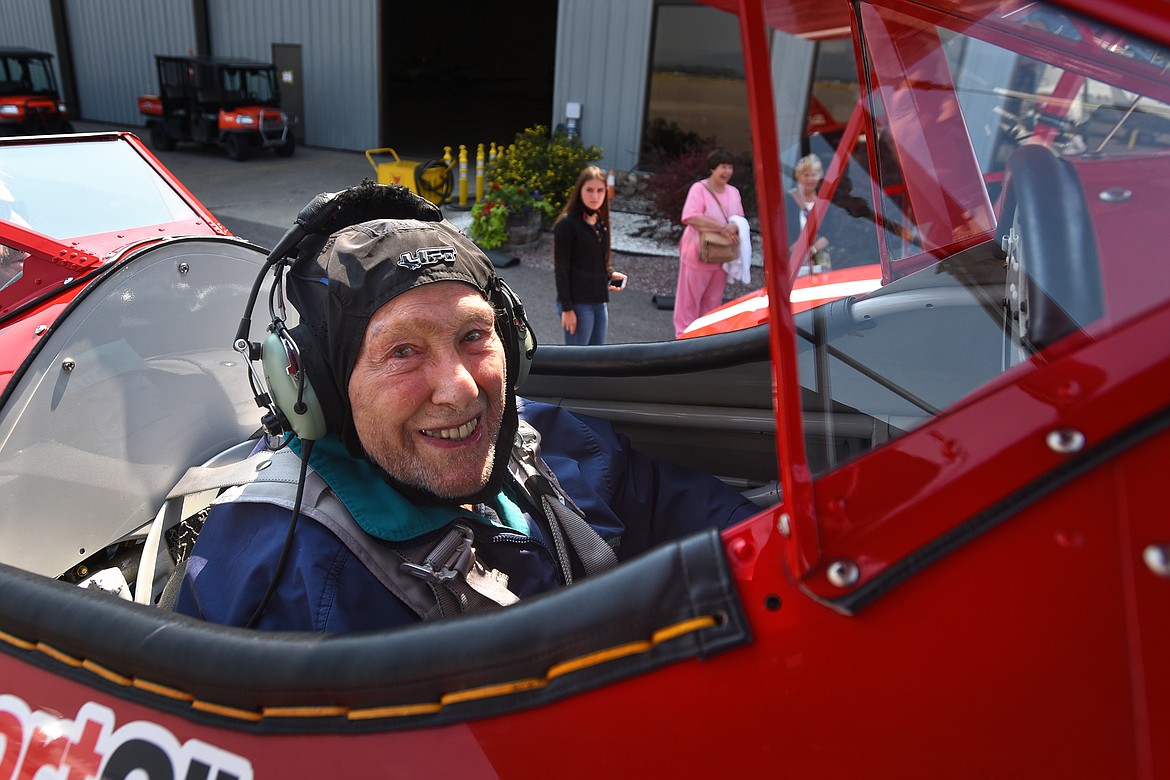 Kenneth Schrammeck, 98, beams from the front seat of a Boeing-Stearman Model 75 biplane at Glacier International Airport on Thursday, Aug. 26, 2021. (Jeremy Weber/Daily Inter Lake)