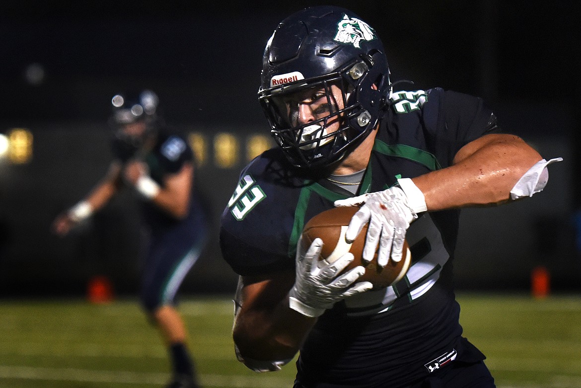 Wolfpack running back Jake Rendina looks upfield after catching a pass in the third quarter of Glacier's 52-0 win over Belgrade at Legends Stadium Friday. (Jeremy Weber/Daily Inter Lake)