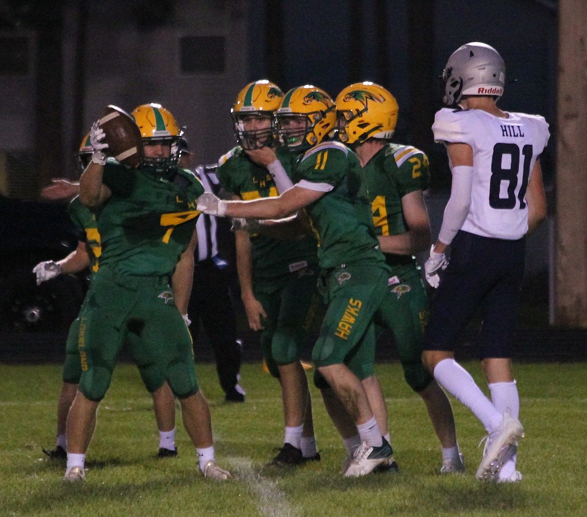 MARK NELKE/Press
Lakeland's Thomas Calder (4) is congratulated after intercepting a pass against Lake City in the first half on Friday night in Rathdrum.