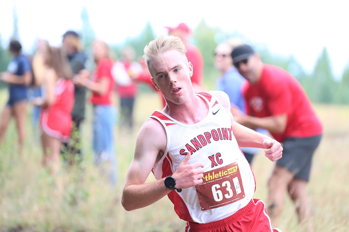 Senior Ben Ricks rounds a corner during the Pine Street Woods Invite on Aug. 27.