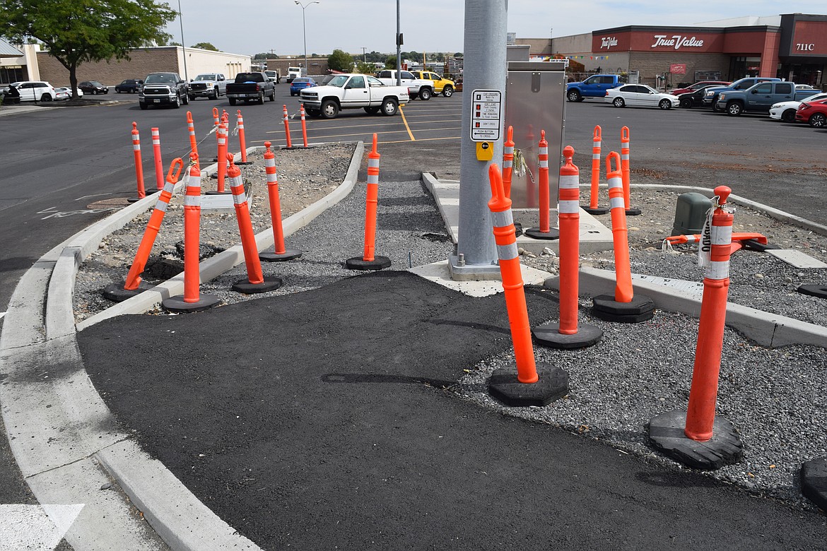 Temporary asphalt installed by Moses Lake city workers, pictured, is meant to make the intersection of Stratford and Valley roads usable for pedestrians until the contract to complete the work can be awarded.