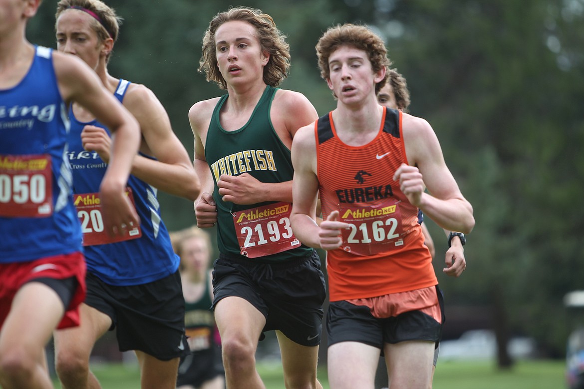 Whitefish's Deneb Linton keeps up with the front of the pack at the Libby Cross Country Invitational meet on Friday. He ran to a fifth-place finish. (William Langhorne/The Western News)