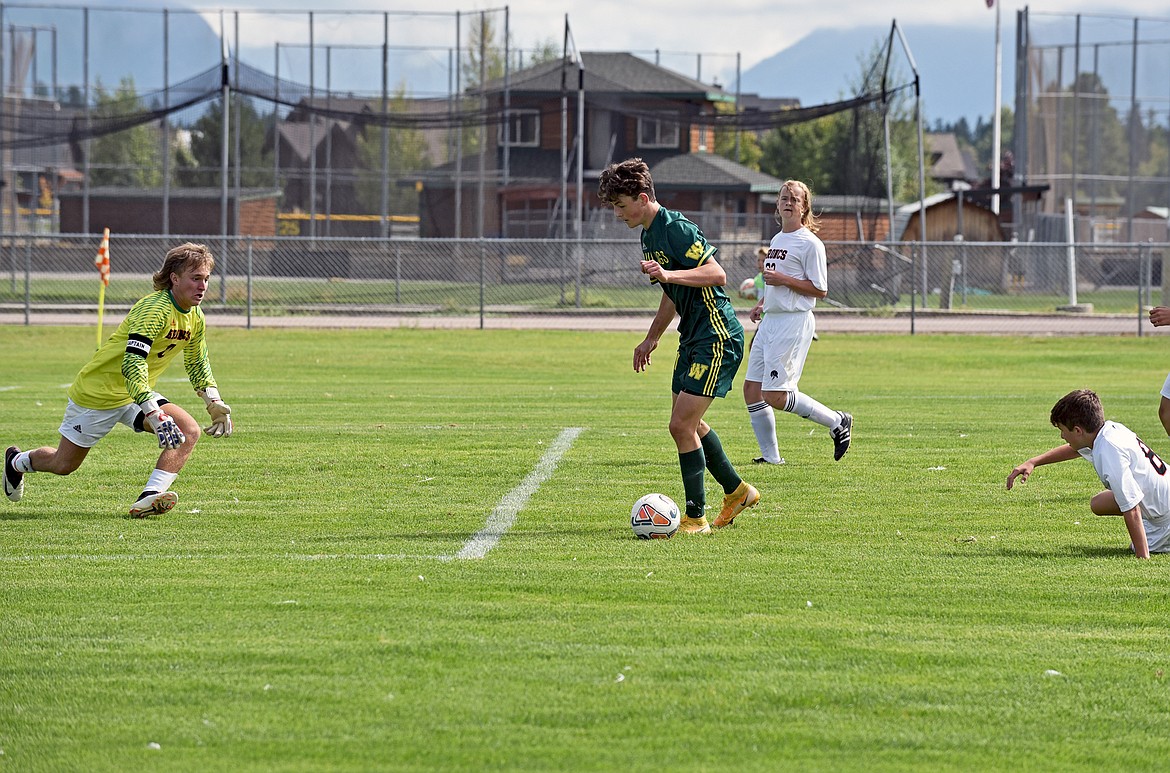 Bulldog Collin Lyman breaks through the Frenchtown defense to take on the keeper during a game at Smith Fields in Whitefish on Saturday. (Whitney England/Whitefish Pilot)